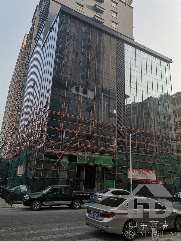 為什么現(xiàn)代建筑用玻璃幕墻？
